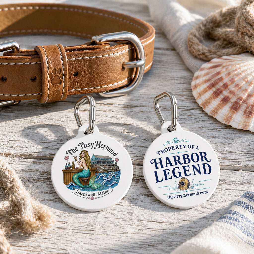 The Titsy Mermaid Harbor Legend Pet Tag — front mermaid artwork and back Property of a Harbor Legend text on white round metal tags