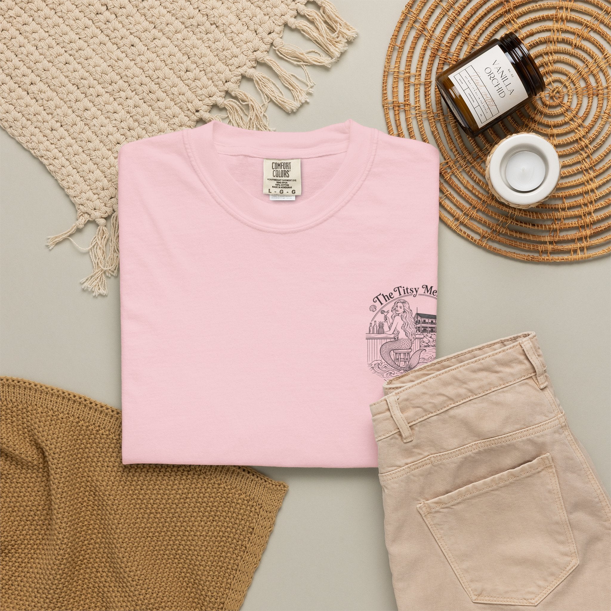 The Titsy Mermaid Classic Tee — folded lifestyle mockup